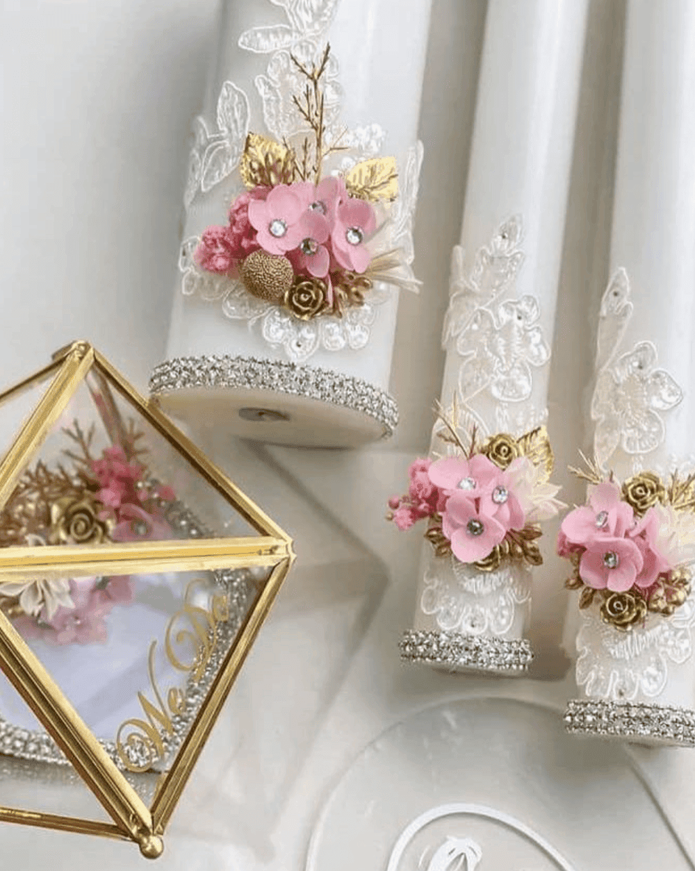 White wedding candles decorated with blush flowers